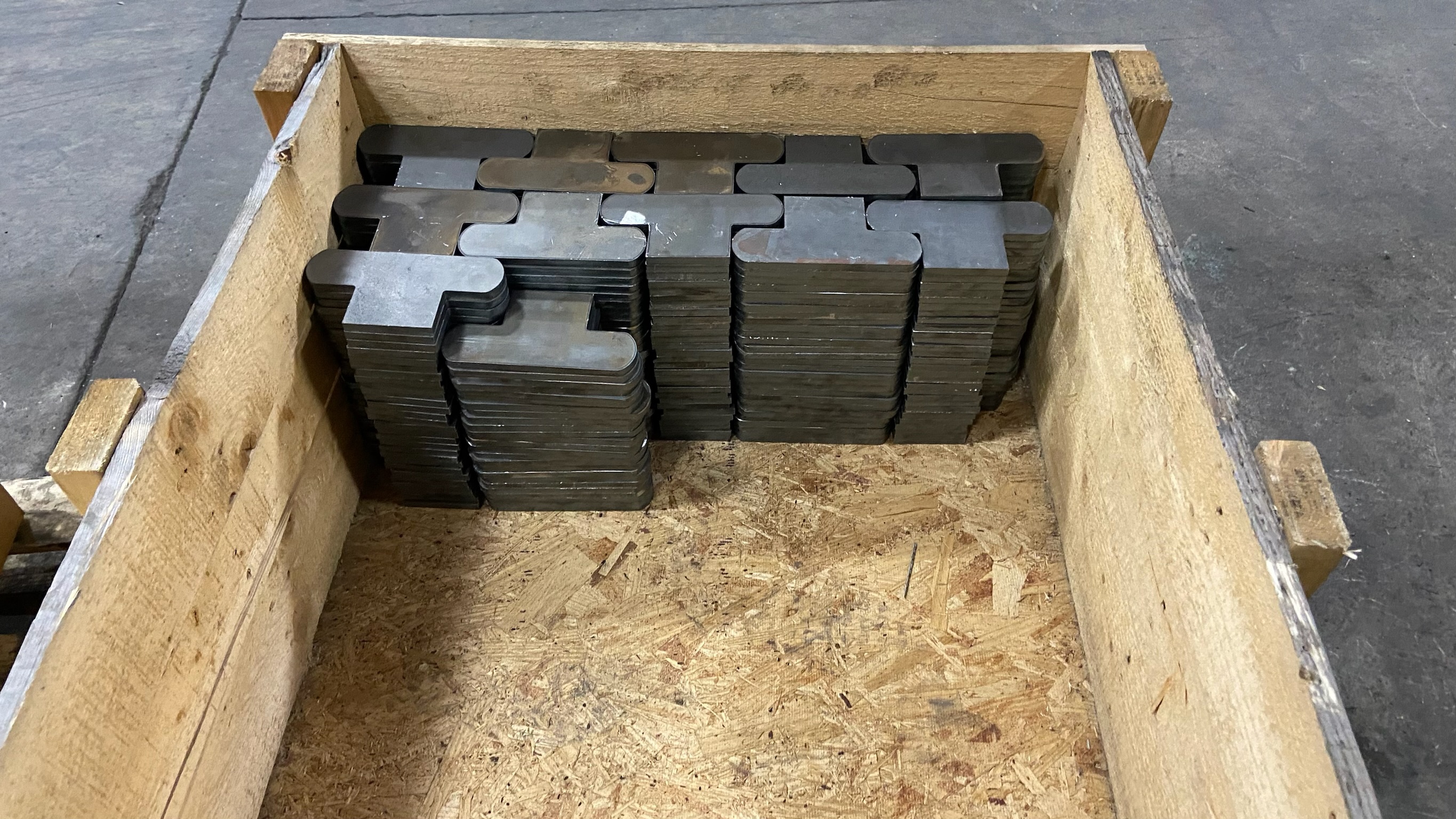 Bin of laser-cut steel blanks produced in the Ahner fabrication shop